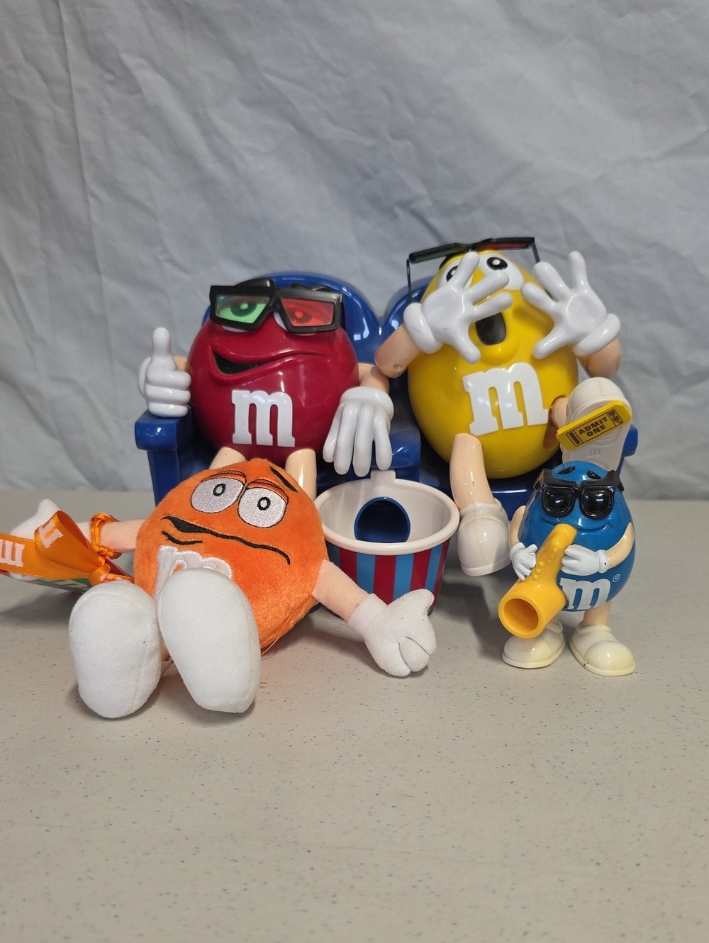 Collectible M&M's "At The Movies" candy dispenser, Orange Plush, Blue Dispenser